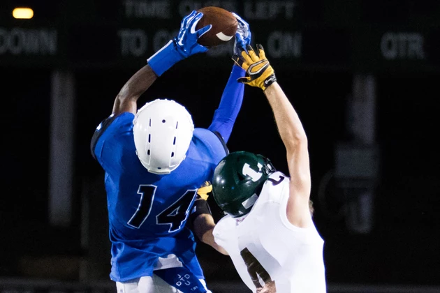 John Tyler Javontavius Mosley goes up for a interception, return it 15 yards.