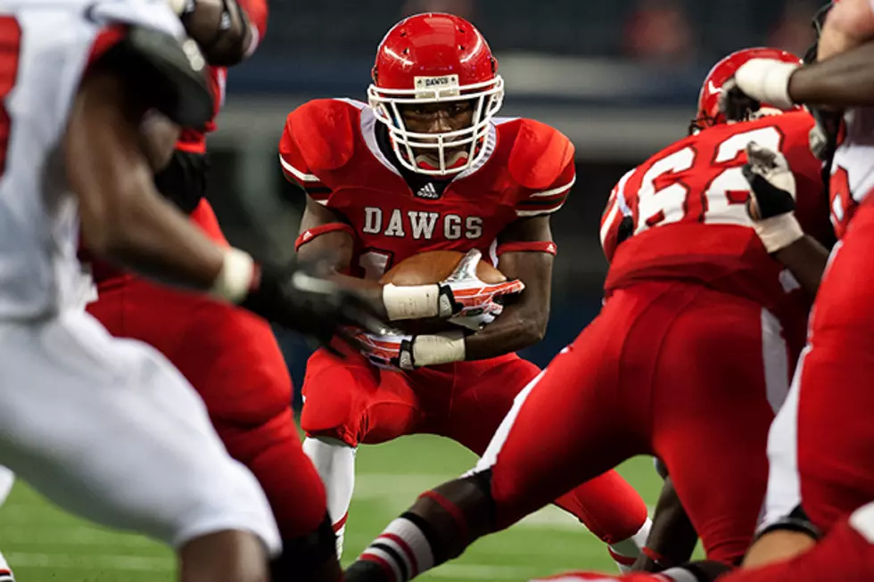 Carthage running back Tevin Pipkin secures the ball during his team's 34-23 win over Kilgore in the Class 3A Division I state championship Friday at AT&T Stadium in Arlington. (Christopher Vinn, ETSN.fm)