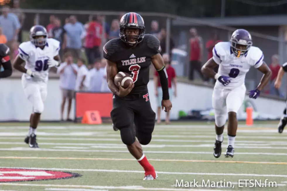 Tyler Lee quarterback Zach Hall escapes for a 64-yard touchdown run in the first quarter of the Red Raiders' game vs. Lufkin on Friday night in Tyler.