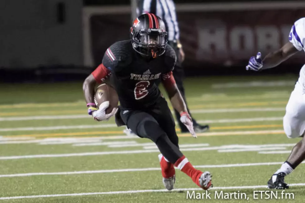 Tyler Lee receiver Tyrec Grayson looks for room to run following a reception during the Red Raiders' game vs. Lufkin on Friday night in Tyler.