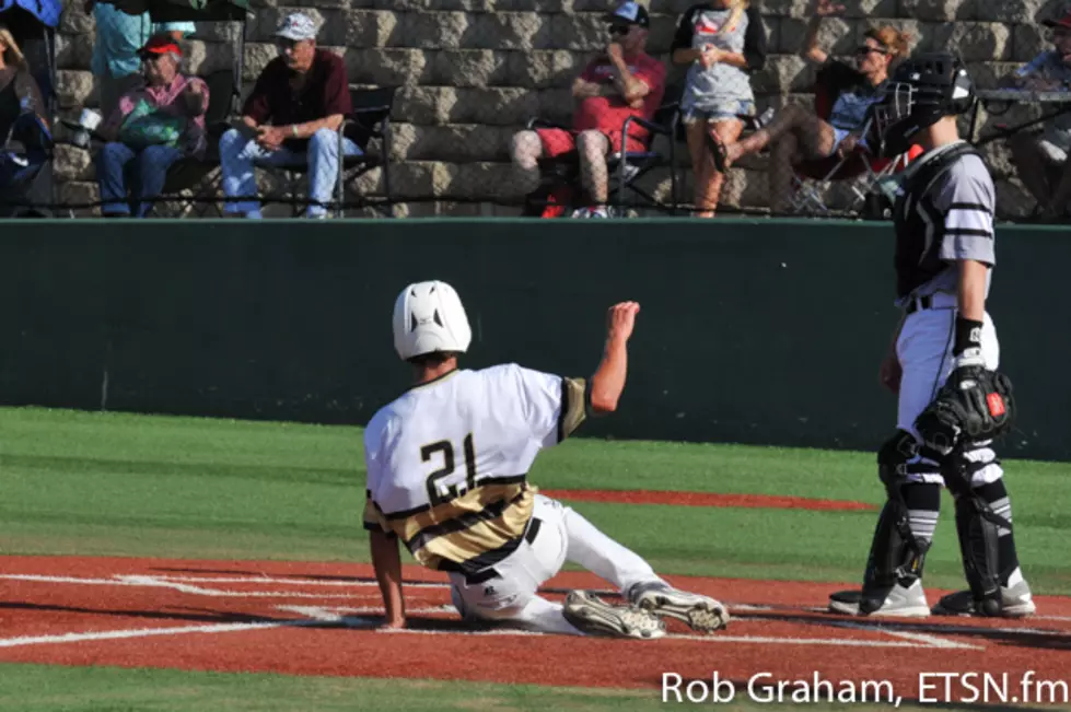 Carson Cox slides in for a score from third base after Argyle bobbled a pickoff attempt at first base. Cox also recorded two RBI and a triple during the meeting.
