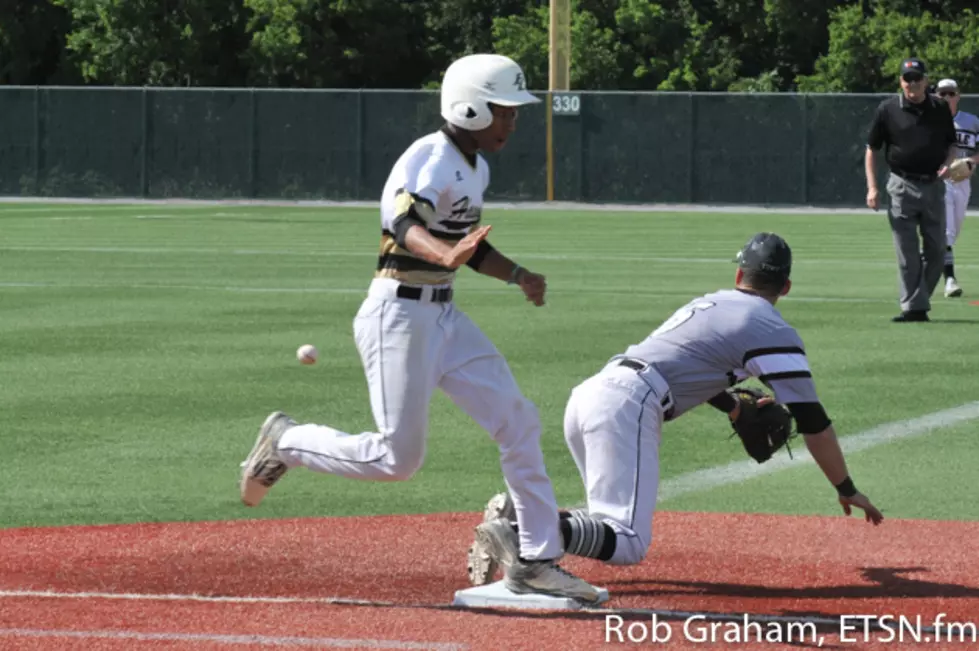 Vashon Williams reaches base safely in the second inning after bunting for a hit.